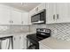 This modern kitchen features stainless appliances and quartz counters at 8413 Lopez Dr, Tampa, FL 33615