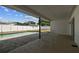 Covered patio area overlooking a pool and fenced backyard at 8413 Lopez Dr, Tampa, FL 33615