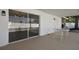 Covered patio offers seamless transition to indoor space with sliding glass door and overlooks the pool at 8413 Lopez Dr, Tampa, FL 33615