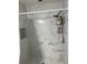 Shower featuring marble style tile walls with built-in shelves and modern fixtures at 8423 Edgewater Place Blvd, Tampa, FL 33615