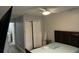 Bedroom featuring modern furniture, a closet, and neutral wall color at 8423 Edgewater Place Blvd, Tampa, FL 33615