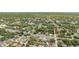 Aerial view of a neighborhood with tree-lined streets and well-maintained homes at 9107 Spring Hill Dr, Spring Hill, FL 34608