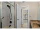 Bathroom features a shower with textured tiling and updated fixtures at 9107 Spring Hill Dr, Spring Hill, FL 34608