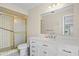 Renovated bathroom features a modern white vanity, updated fixtures, a large mirror, and a stylish tiled shower at 9107 Spring Hill Dr, Spring Hill, FL 34608