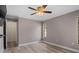 Bedroom features a ceiling fan, new flooring, and a closet at 9107 Spring Hill Dr, Spring Hill, FL 34608