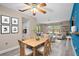 Light and bright dining room open to the living room and kitchen with decor at 9107 Spring Hill Dr, Spring Hill, FL 34608
