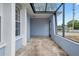 Spacious covered front porch offering ample space for seating and outdoor decor at 9107 Spring Hill Dr, Spring Hill, FL 34608