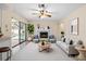 Bright and modern living room with fireplace and pool views at 9107 Spring Hill Dr, Spring Hill, FL 34608