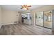Spacious living area boasts open floor plan, backyard access, and kitchen view at 9107 Spring Hill Dr, Spring Hill, FL 34608