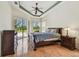 Bright bedroom with sliding glass doors providing access to the outdoors and lots of natural light at 9219 Irondale Ln, Hudson, FL 34667