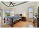 Spacious bedroom with tray ceiling, ample natural light, and classic furnishings, perfect for relaxation at 9219 Irondale Ln, Hudson, FL 34667