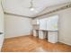 Bright bedroom with hardwood floors, built-in desk, and large window with a view at 9219 Irondale Ln, Hudson, FL 34667