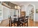 Cozy breakfast nook featuring a dark wood table and chairs, with a view to the backyard at 9219 Irondale Ln, Hudson, FL 34667