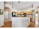 Kitchen featuring stainless steel appliances, countertop, and wood flooring at 9219 Irondale Ln, Hudson, FL 34667