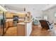 Open kitchen features stainless steel appliances, breakfast bar, and seamless flow to the living area at 9219 Irondale Ln, Hudson, FL 34667