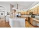 Kitchen with stainless steel appliances, counter seating, and an open floor plan at 9219 Irondale Ln, Hudson, FL 34667