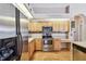 Kitchen featuring stainless steel appliances, wood cabinets, and breakfast nook at 9219 Irondale Ln, Hudson, FL 34667