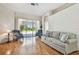 Bright living room with large sliding glass doors leading to the outdoor patio area at 9219 Irondale Ln, Hudson, FL 34667
