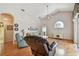 Inviting living room with hardwood floors, vaulted ceilings, and ample natural light at 9219 Irondale Ln, Hudson, FL 34667