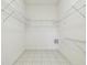 Walk-in closet with shelving and tile floor at 9219 Irondale Ln, Hudson, FL 34667