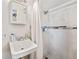 This bathroom features a stylish sink, modern shower head and lovely white tiled shower at 9616 56Th N St, Pinellas Park, FL 33782