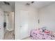 This bedroom is well-lit and features a ceiling fan and access to other rooms at 9616 56Th N St, Pinellas Park, FL 33782
