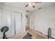 This bedroom features a ceiling fan, closet and access to other rooms at 9616 56Th N St, Pinellas Park, FL 33782