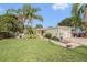 Charming single-story home with lush landscaping, a well-maintained front yard and a one car garage at 9616 56Th N St, Pinellas Park, FL 33782