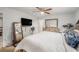Main bedroom with a wooden dresser, large mirror, carpeted floors, and a ceiling fan at 9616 56Th N St, Pinellas Park, FL 33782