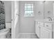 Bright bathroom with white vanity, updated fixtures, and a window providing natural light at 113 E Bosphorous Ave # 5, Tampa, FL 33606
