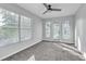 Bright bedroom featuring plush carpeting and a sliding glass door leading to a balcony at 113 Bosphorous Ave # 5, Tampa, FL 33606