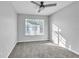 Sunlit bedroom features plush carpets and a large window at 113 Bosphorous Ave # 5, Tampa, FL 33606