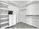 Walk-in closet features built in shelves, drawers, and shelving units at 113 Bosphorous Ave # 5, Tampa, FL 33606