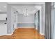 Dining room featuring elegant chandelier, tray ceiling, and large windows with natural light at 113 Bosphorous Ave # 5, Tampa, FL 33606