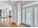 Bright foyer featuring hardwood floors, fresh paint, and natural light from the front door at 113 E Bosphorous Ave # 5, Tampa, FL 33606