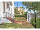 Front yard with grass, brick pavers, metal fence, steps and views of buildings in the background at 113 Bosphorous Ave # 5, Tampa, FL 33606