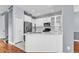 Bright kitchen features white cabinets, stainless steel appliances, and a center island at 113 Bosphorous Ave # 5, Tampa, FL 33606