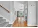 Interior hallway with views of the living room and kitchen. Hardwood floors and grey paint at 113 Bosphorous Ave # 5, Tampa, FL 33606