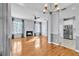 Open-concept living area with fireplace, hardwood floors, and seamless flow to the adjacent kitchen at 113 Bosphorous Ave # 5, Tampa, FL 33606