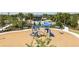 Vibrant playground with slides, climbing structures, and soft ground covering, set within lush landscaping at 12305 49Th E St, Parrish, FL 34219
