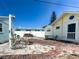 A cozy backyard with vintage brickwork, perfect for outdoor relaxation and entertaining guests at 13326 1St E St, Madeira Beach, FL 33708
