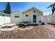 Quaint backyard featuring a charming brick patio and a cozy seating area, perfect for outdoor relaxation at 13326 1St E St, Madeira Beach, FL 33708