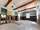 Living room showcasing wooden beams, natural light, and renovation potential with exposed studs at 13326 1St E St, Madeira Beach, FL 33708