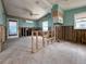 Open-concept living room showcasing exposed framing and vaulted ceilings presents an opportunity for customization at 13326 1St E St, Madeira Beach, FL 33708