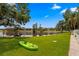 Lush backyard with Kayak on the grass at 13751 Juniper Blossom Dr, Tampa, FL 33618