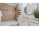 Beautiful bathroom with tiled shower, vanity, and modern fixtures at 13751 Juniper Blossom Dr, Tampa, FL 33618