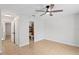 Spacious, tiled bedroom with ceiling fan, neutral decor and a private ensuite bathroom at 13751 Juniper Blossom Dr, Tampa, FL 33618