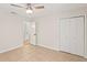 Neutral bedroom with tiled floors, closet, and entry to bathroom at 13751 Juniper Blossom Dr, Tampa, FL 33618