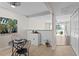 Cozy dining area featuring a modern table setting and bright, neutral decor with a view to the living area at 13751 Juniper Blossom Dr, Tampa, FL 33618