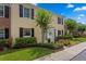 Charming townhome featuring a white door, manicured landscaping, and black shutters for added curb appeal at 13751 Juniper Blossom Dr, Tampa, FL 33618